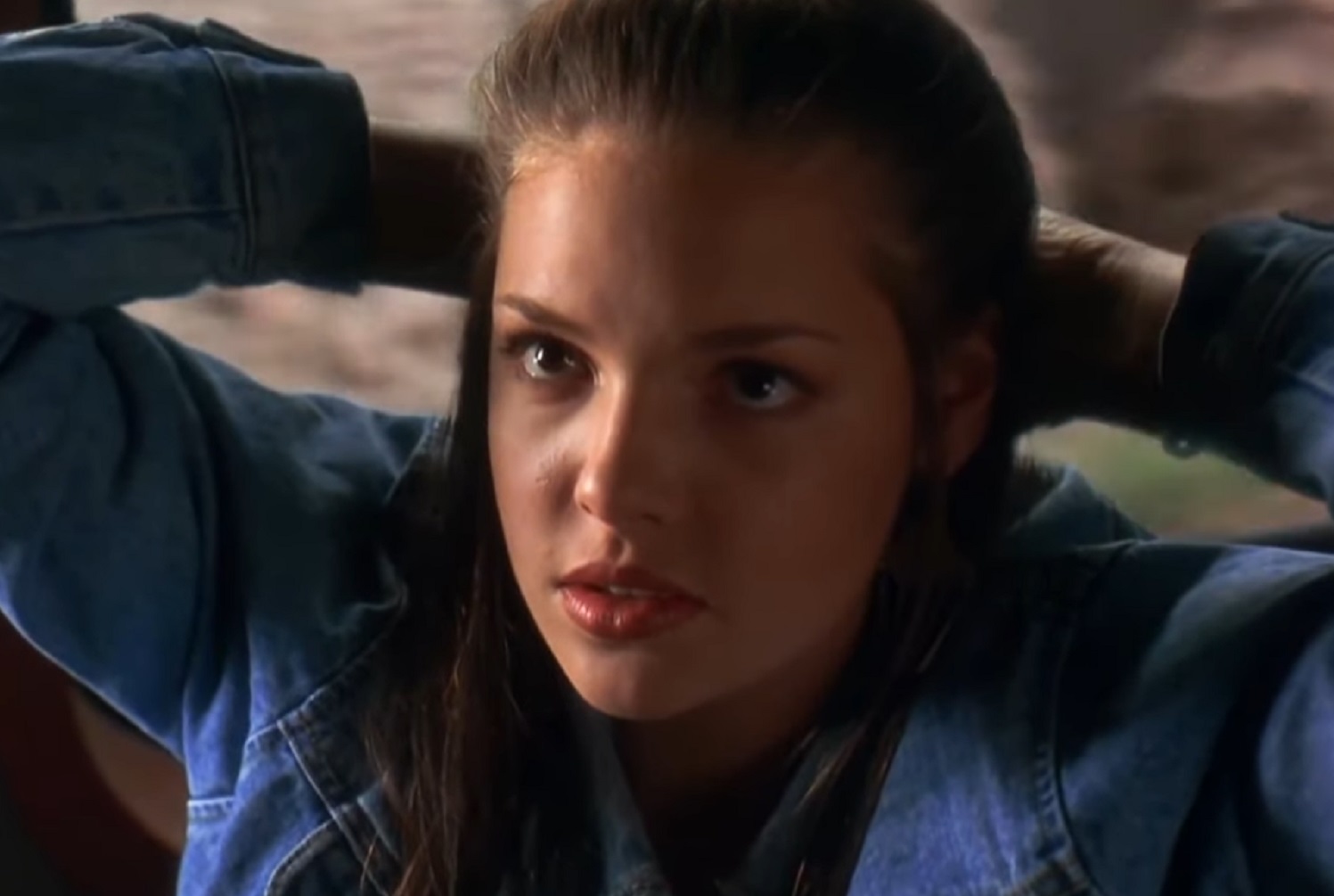 Screenshot: Katherine Heigl wearing blue jacket is looking at side - from Under Siege 2: Dark Territory (1995)