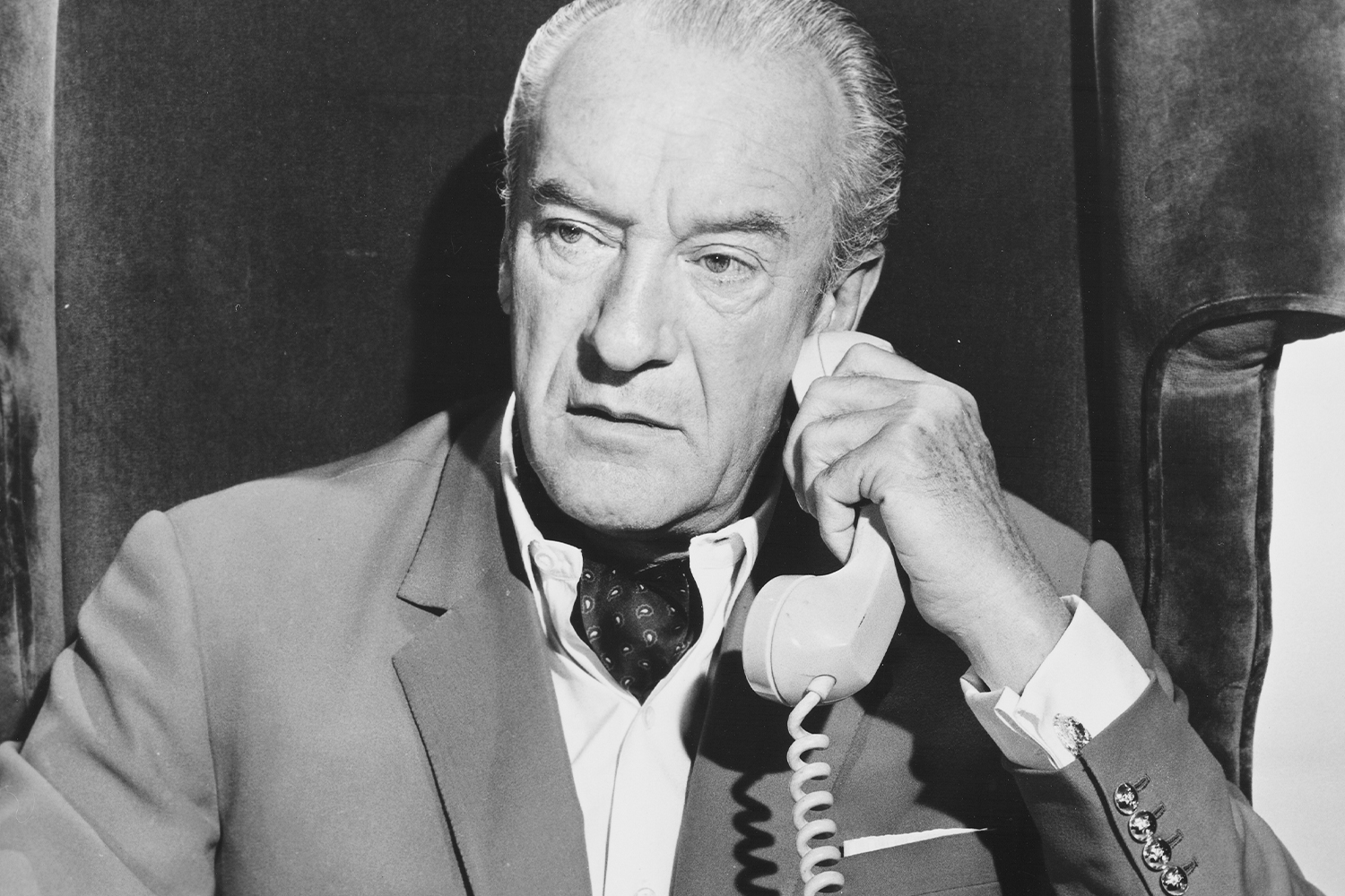 George Sanders Using A White Phone