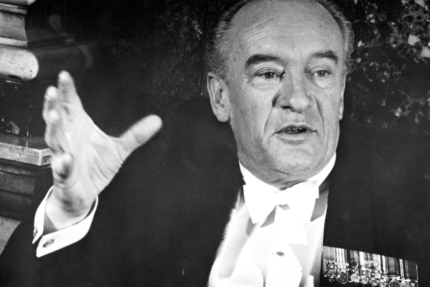 George Sanders With His Hand Up