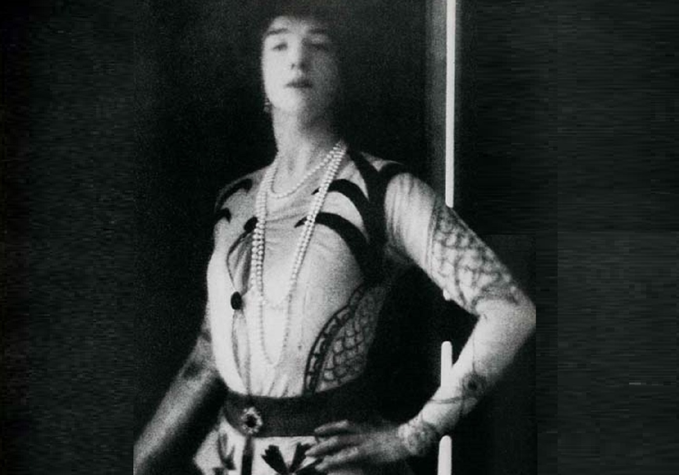 Gertrude Vanderbilt wearing white dress and looking at camera - 1913