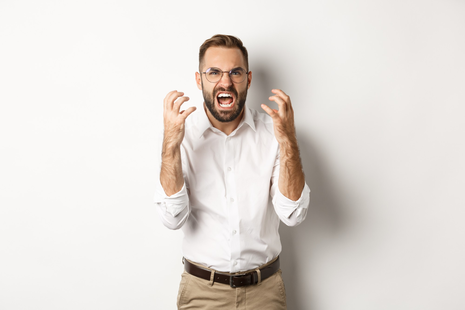 Man in white shirt is screaming.