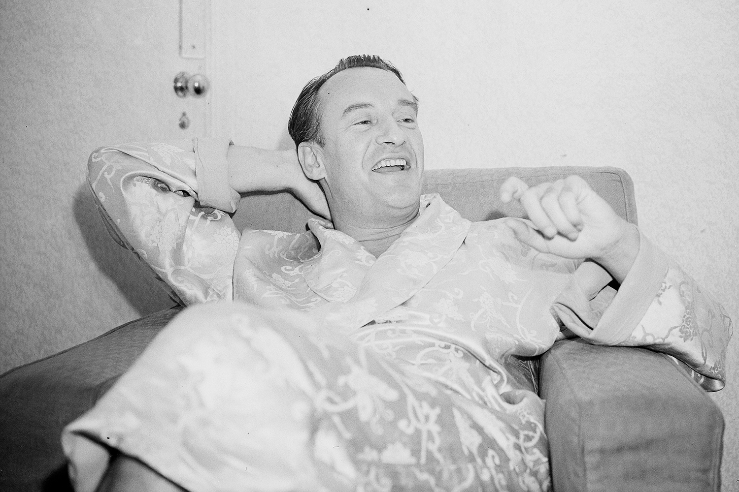 George Sanders Leaning Back And Smiling.