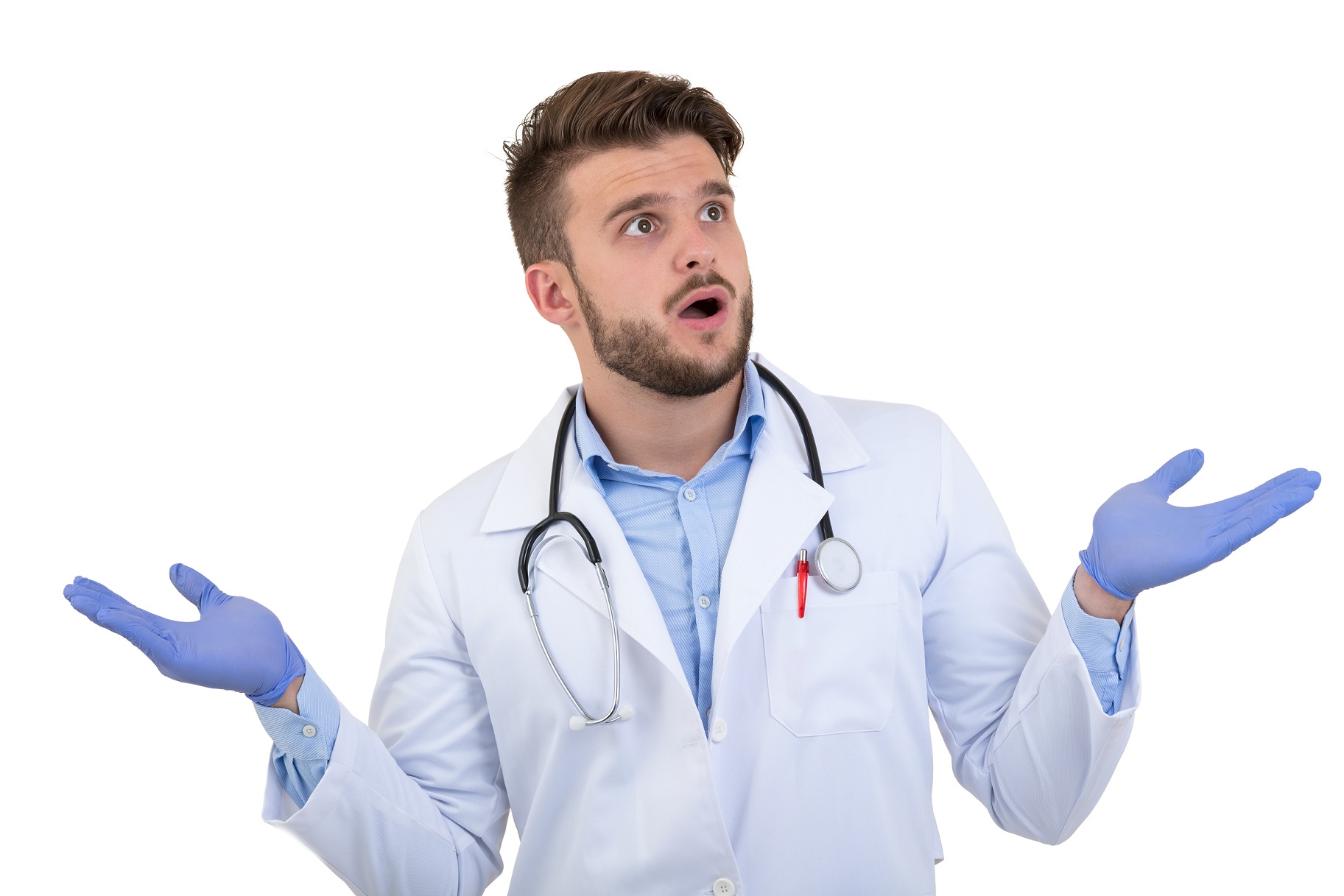 Young doctor is looking at side with arms up and surprised face.
