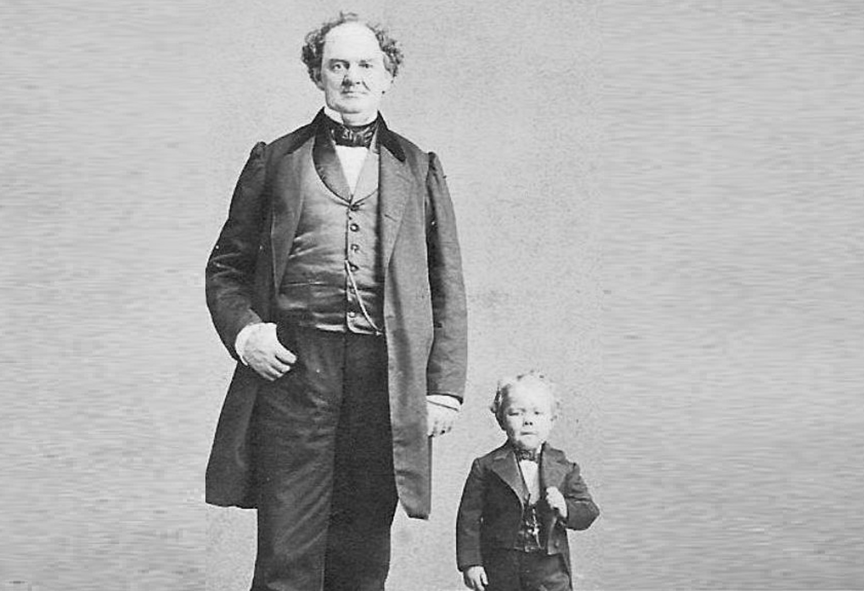 B&W photo of P. T. Barnum and Commodore Nutt looking at camera - circa 1862