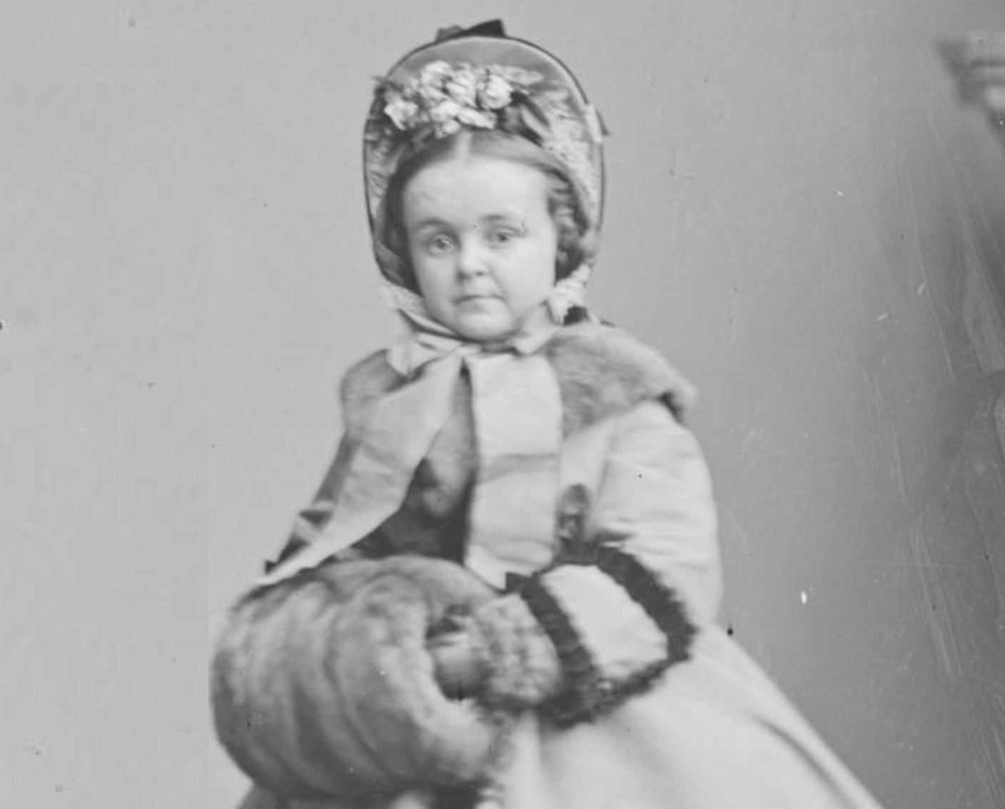 B&W photo of Lavinia Warren wearing winter coat and hat is looking at camera - 1860s