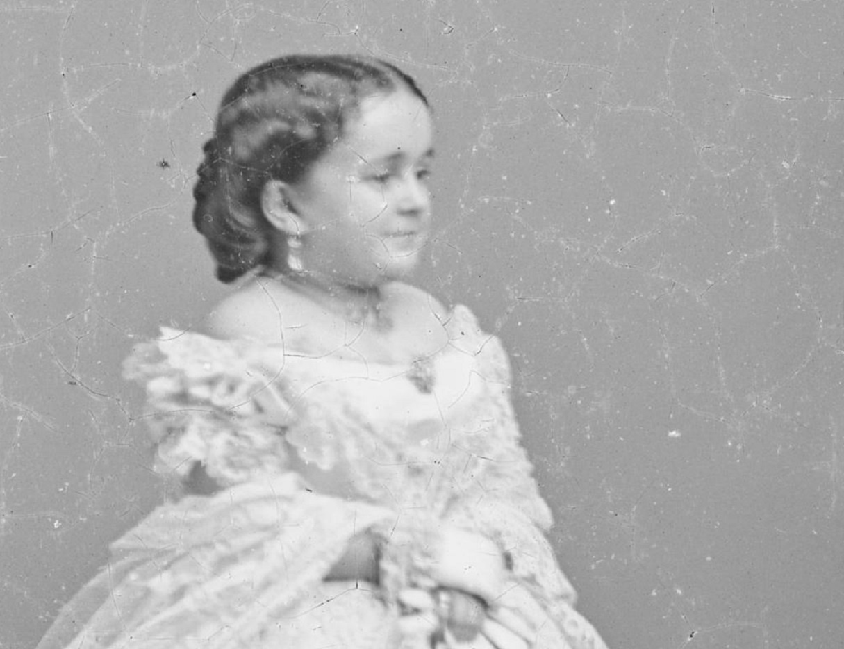 B&W photo of Lavinia Warren wearing white dress is looking at side - 1860s