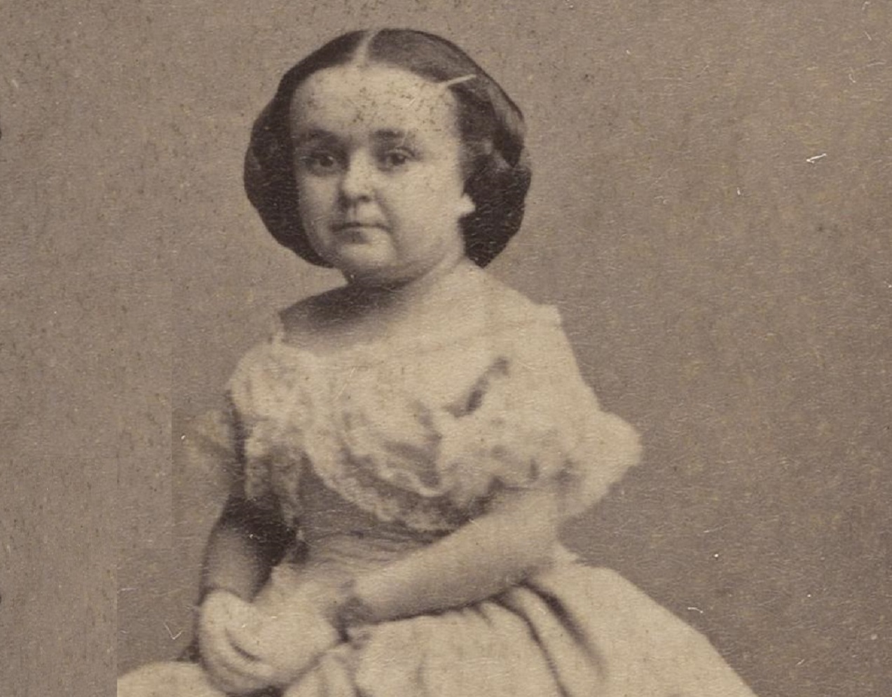 B&W photo of Lavinia Warren wearing white dress is looking at front - 1860s