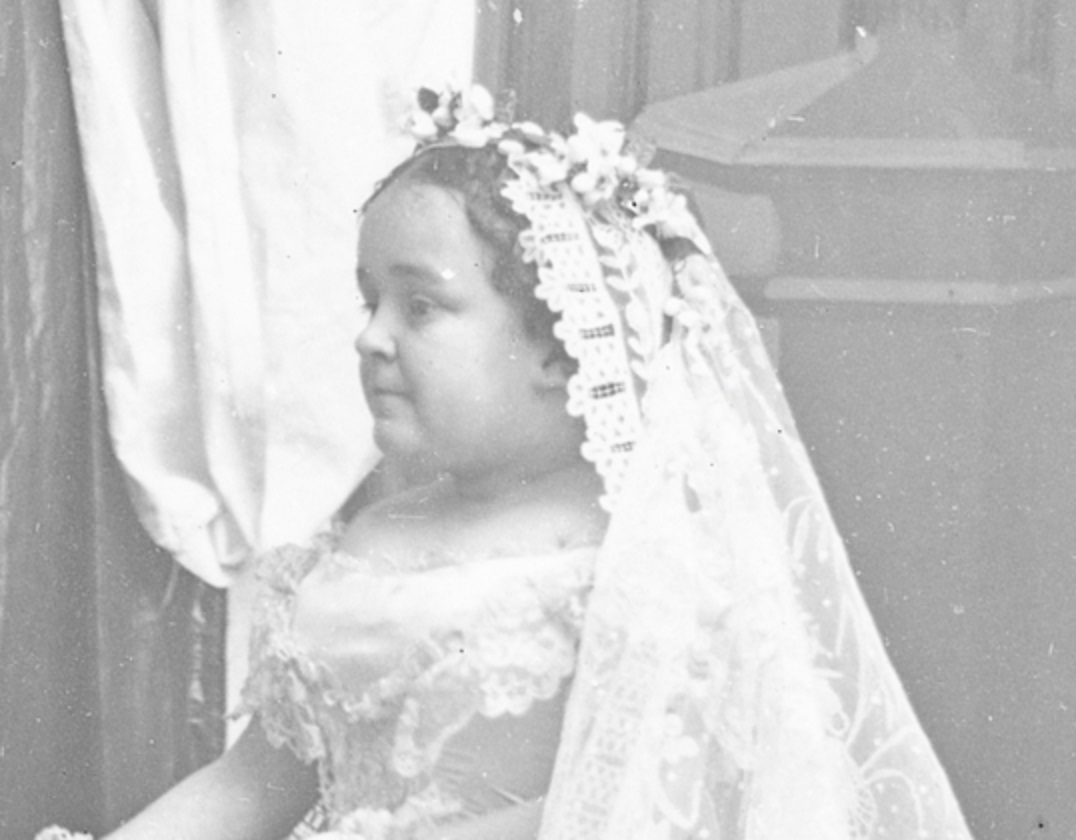 B&W photo of Lavinia Warren wearing white dress is looking at side - 1863