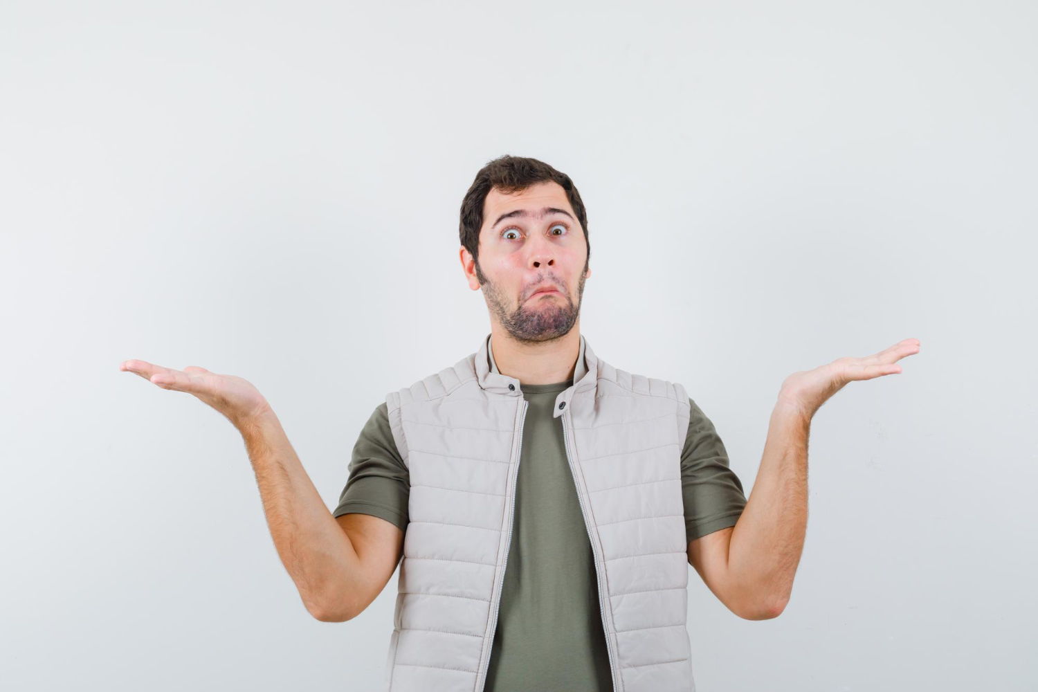 Man is looking with surprised face with arms up.