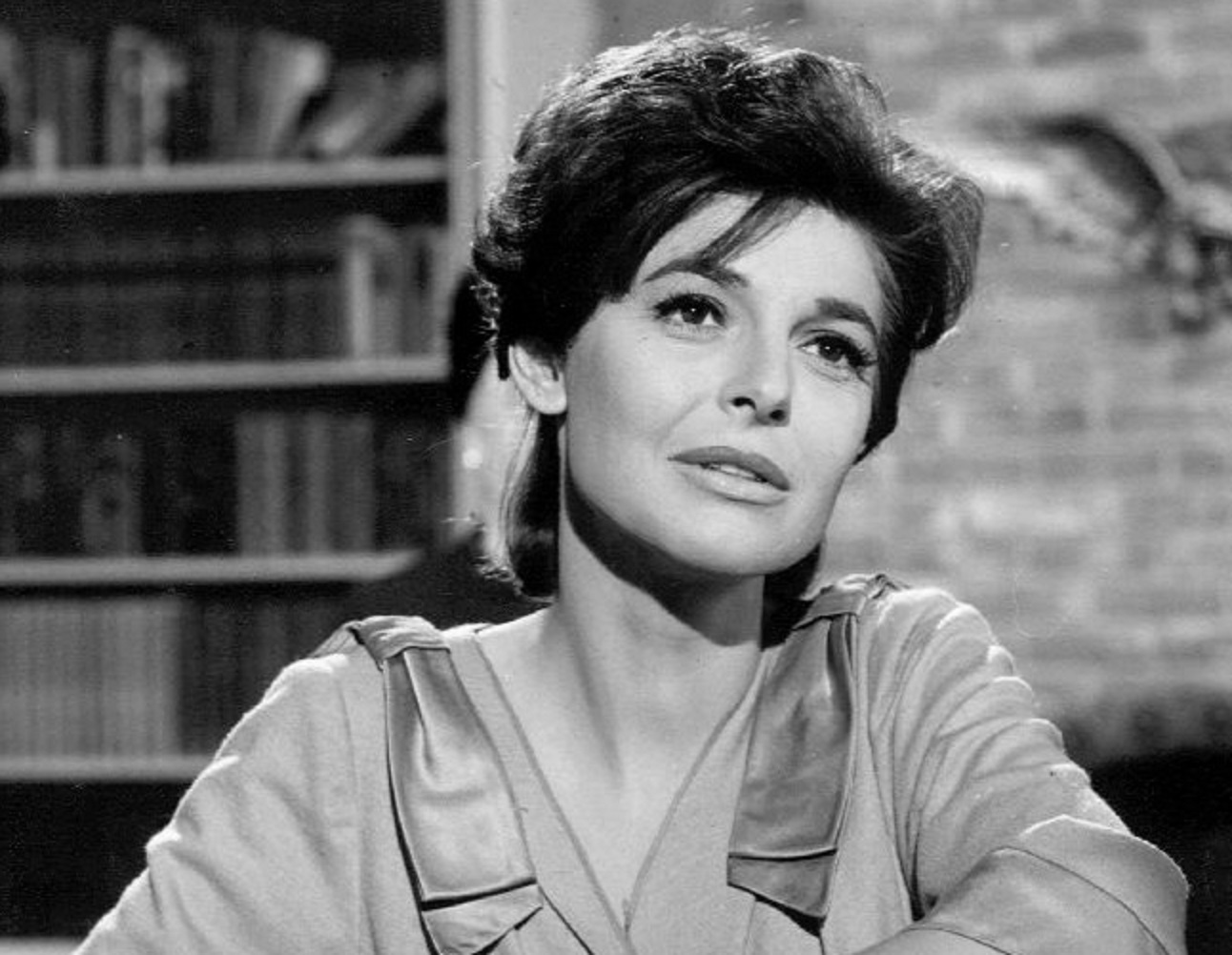 B&W photo of Anne Bancroft wearing dress is looking at side - 1964