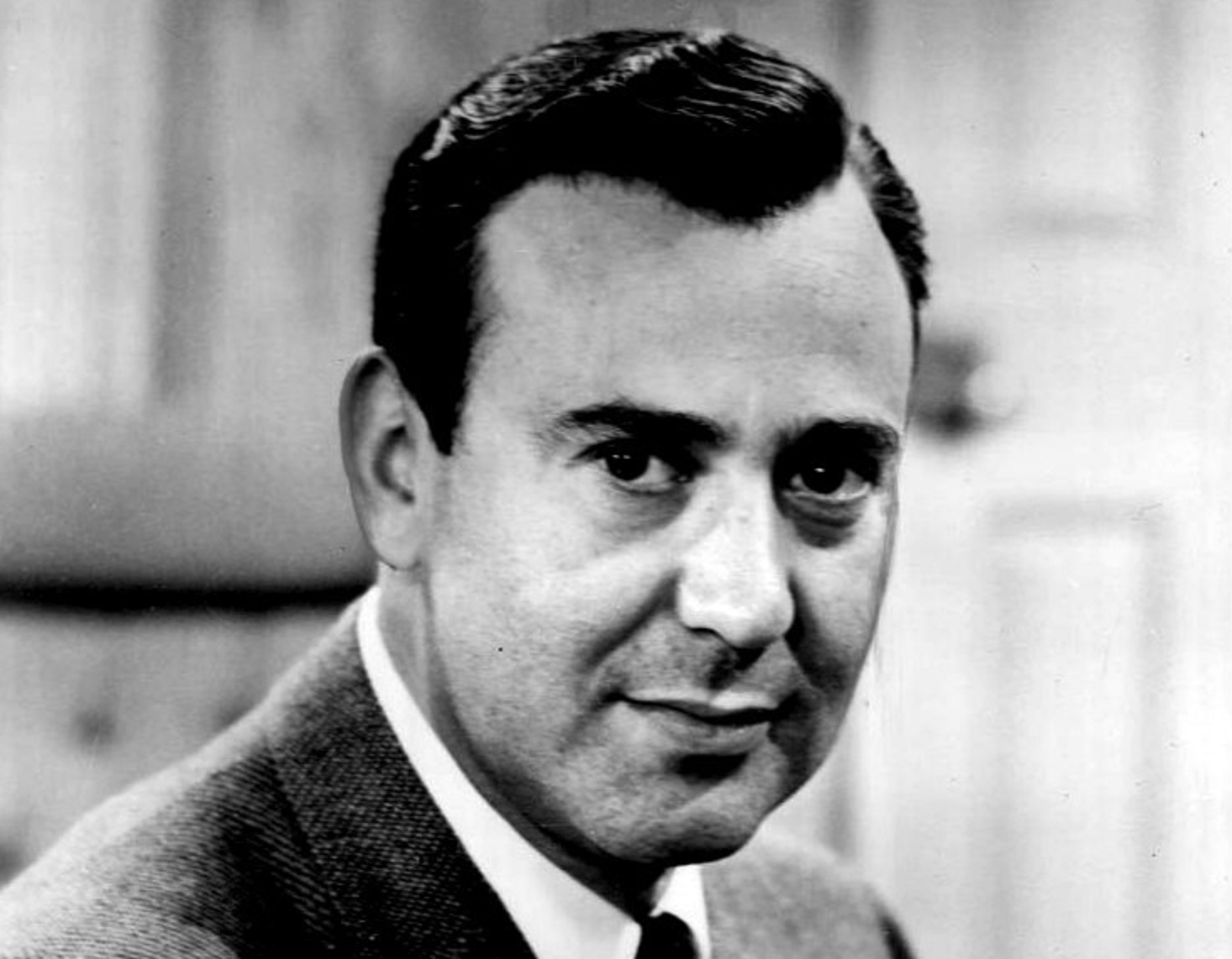 B&W portrait of Carl Reiner wearing grey suit and tie - 1962