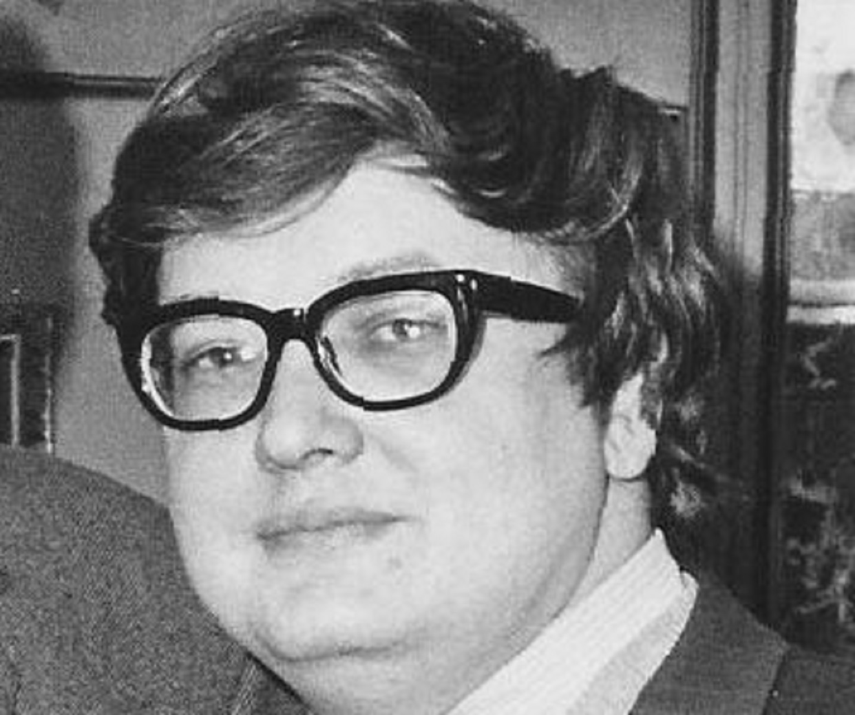 Roger Ebert wearing glasses and looking at camera - 1970