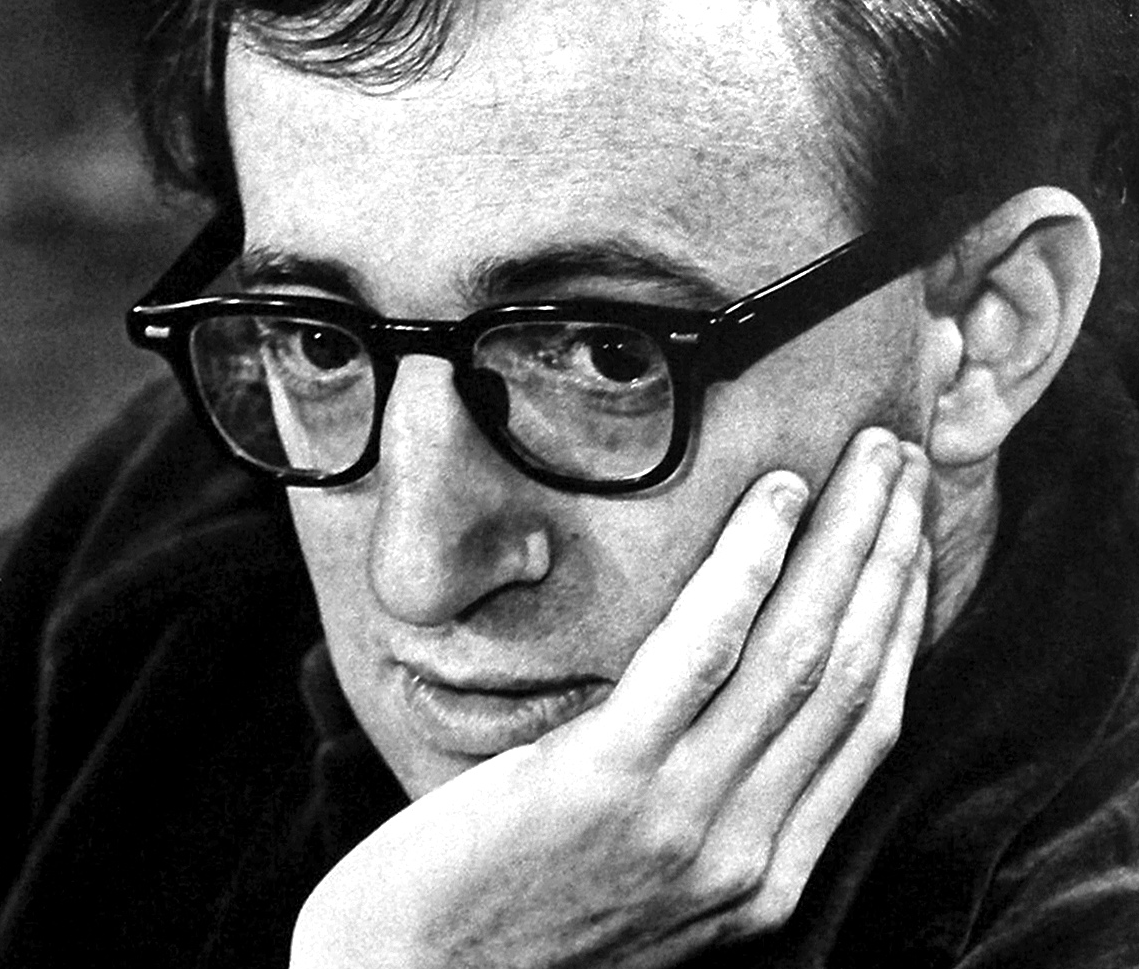 B&W photo of Woody Allen wearing glasses ,looking at side - early 1970
