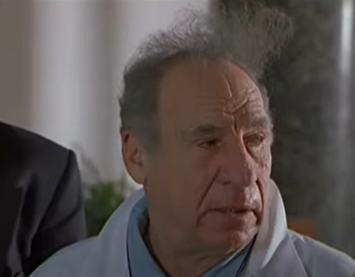 Screenshot: Mel Brooks is looking at side with sad face - from Screw Loose (1999)