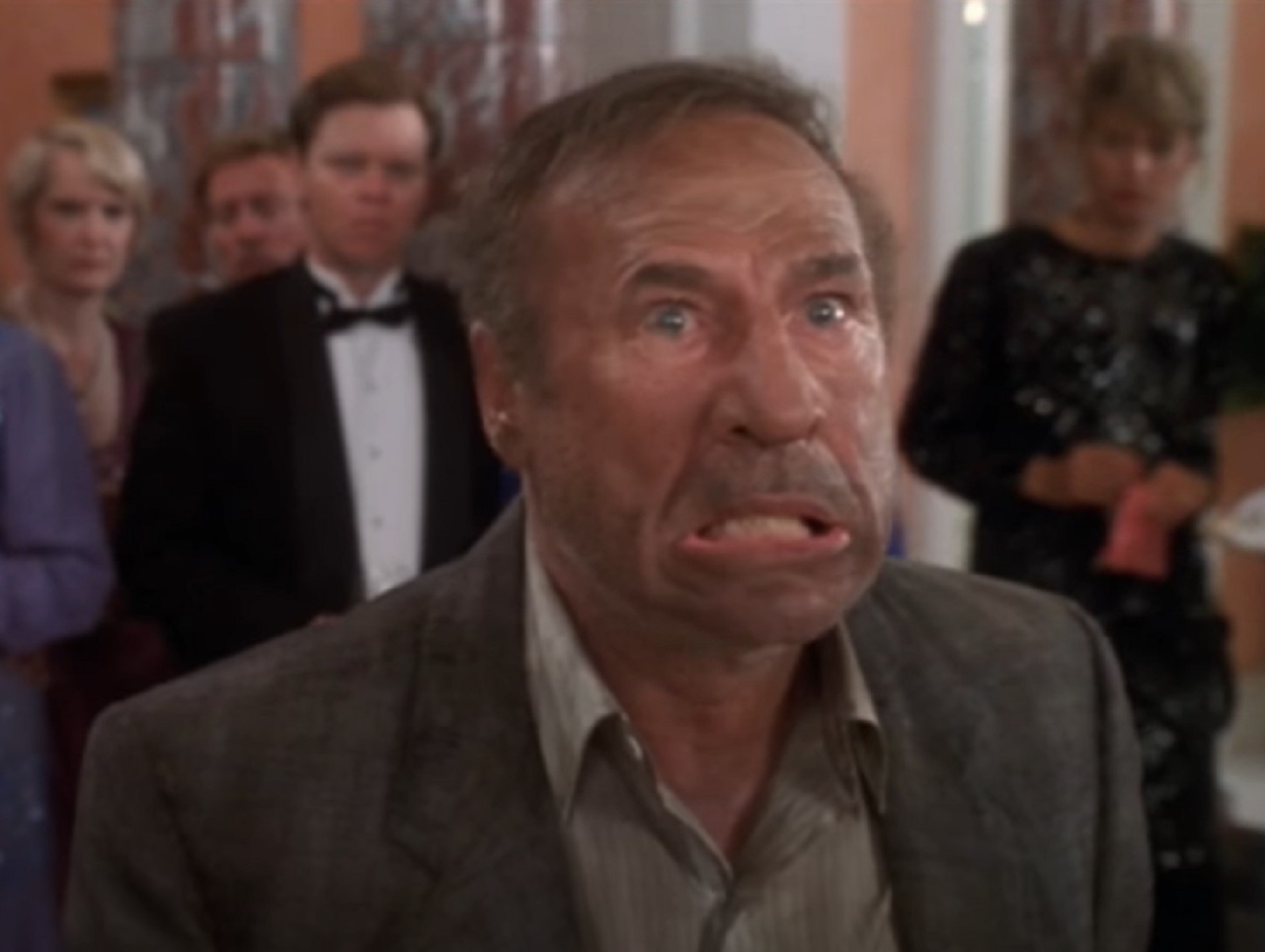 Screenshot: Mel Brooks is looking at side with surprised face - from Life Stinks (1991)
