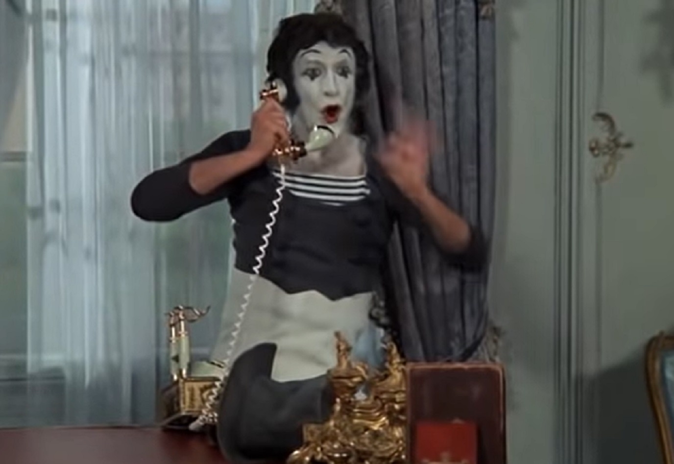 Screenshot: Marcel Marceau is talking on telephone - from Silent Movie (1976)