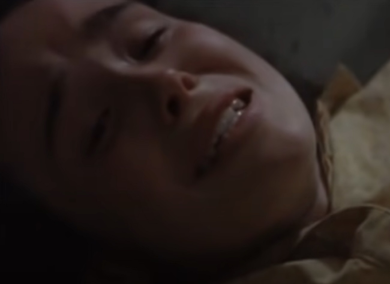 Screenshot: Elliot Page laying on the floor with crying face - from An American Crime (2007)