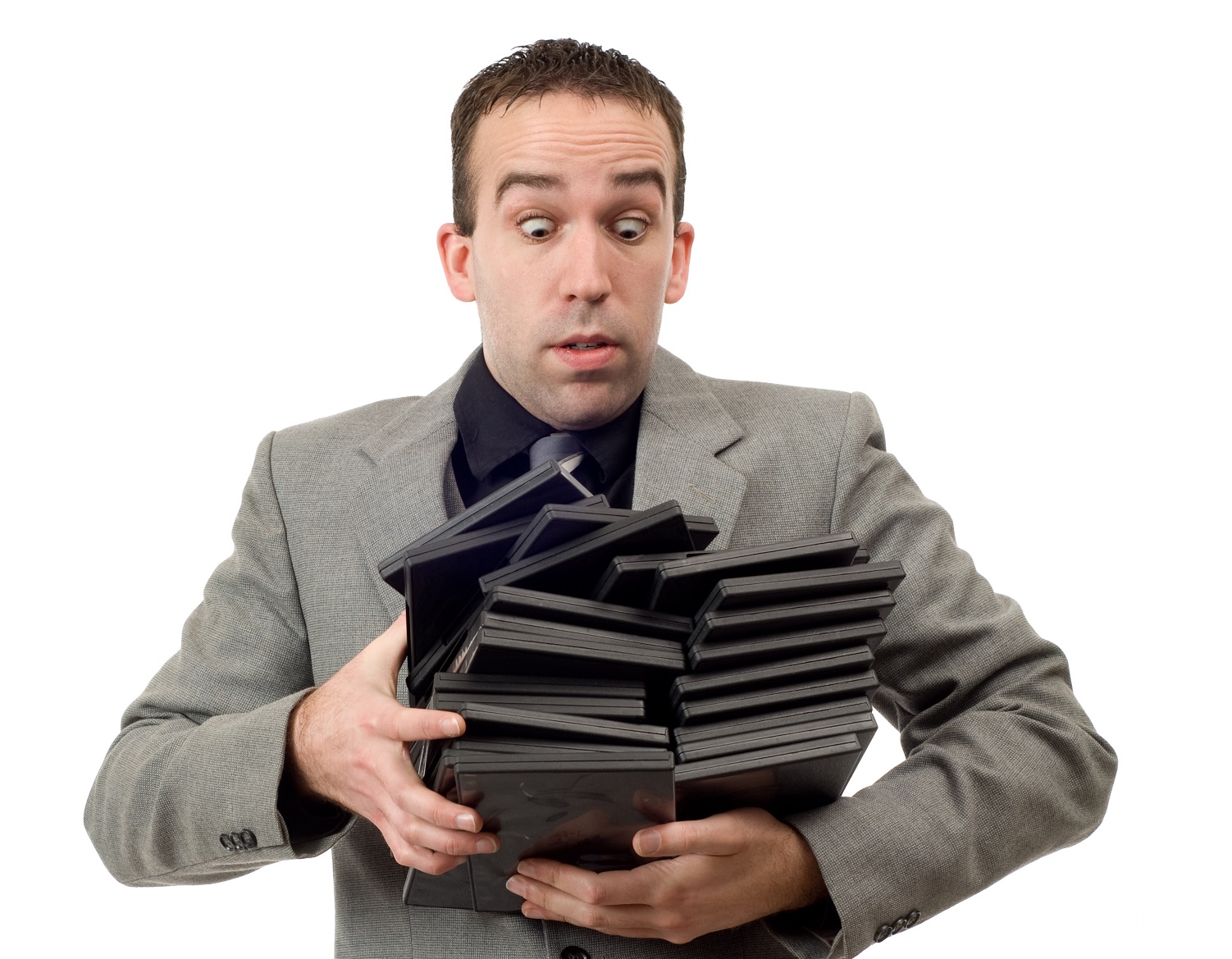 Man is holding DVD movies in his hands and having a surprised face.