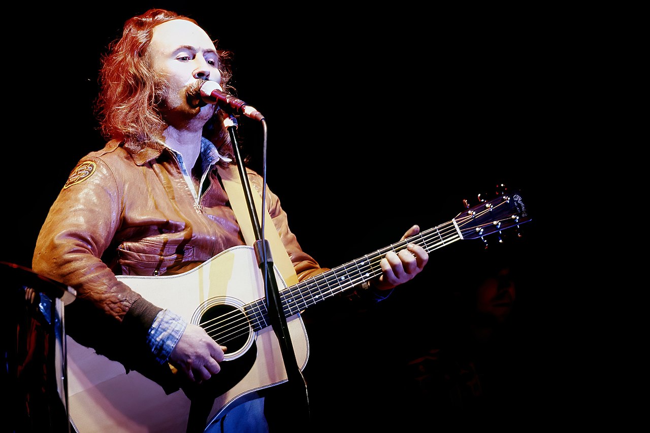 David Crosby with leather jacket is performing live on stage - 1983