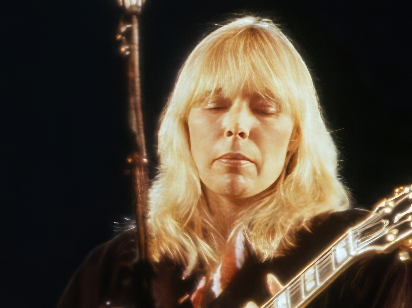 Joni Mitchell is playing on guitar, performing on stage - 1983