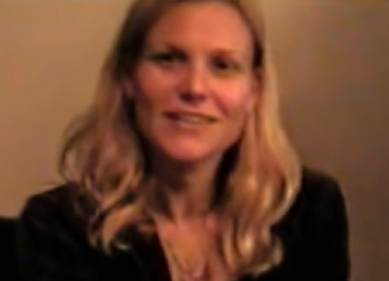 Screenshot: Kilauren Gibb ( Joni Mitchell's daughter) is looking and smiling at camera- from Joni Mitchell: A Woman of Heart and Mind (2003)