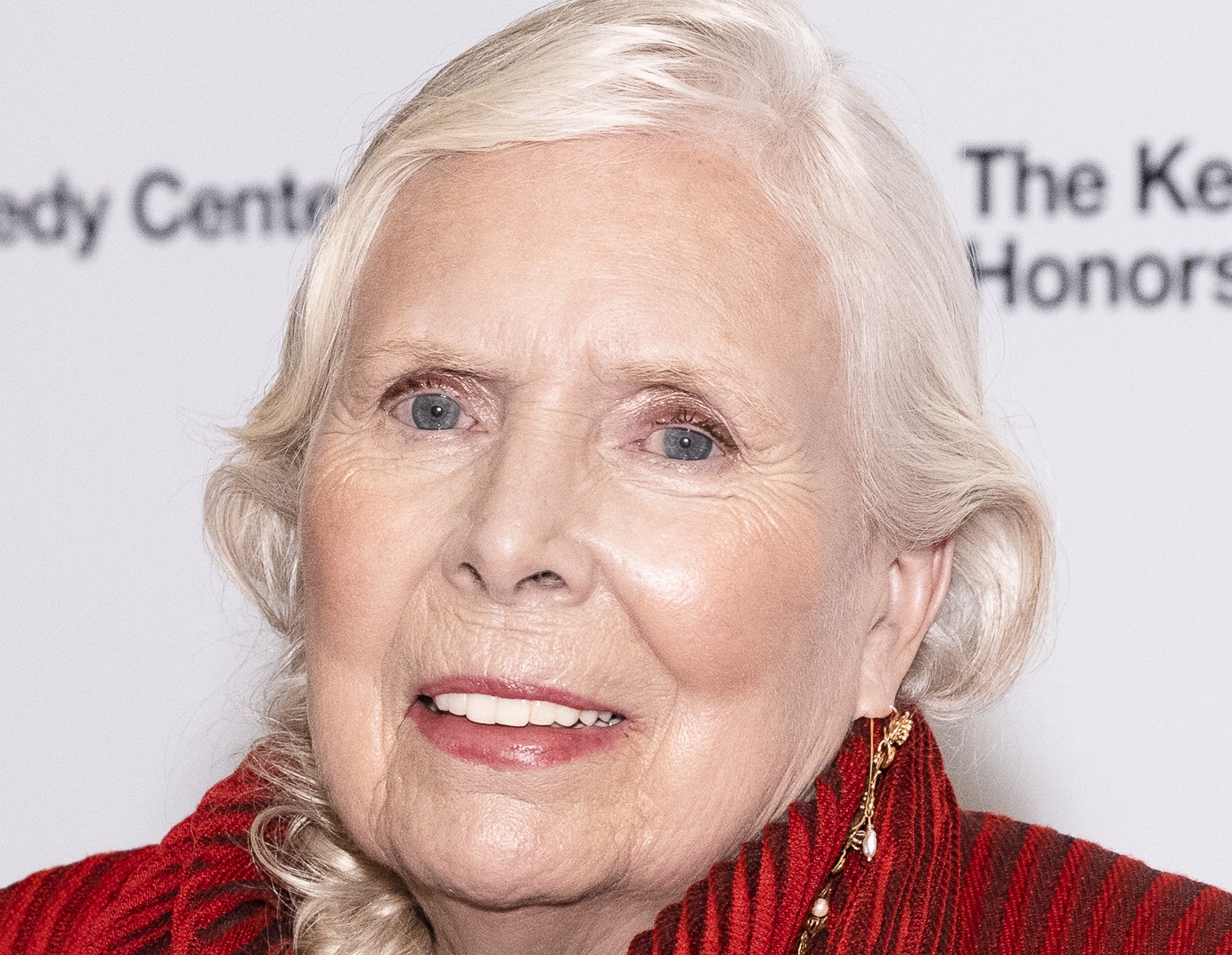 Joni Mitchell is looking and smiling at camera - 2021