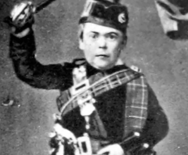 General Tom Thumb portrait wearing a hat holding a sword