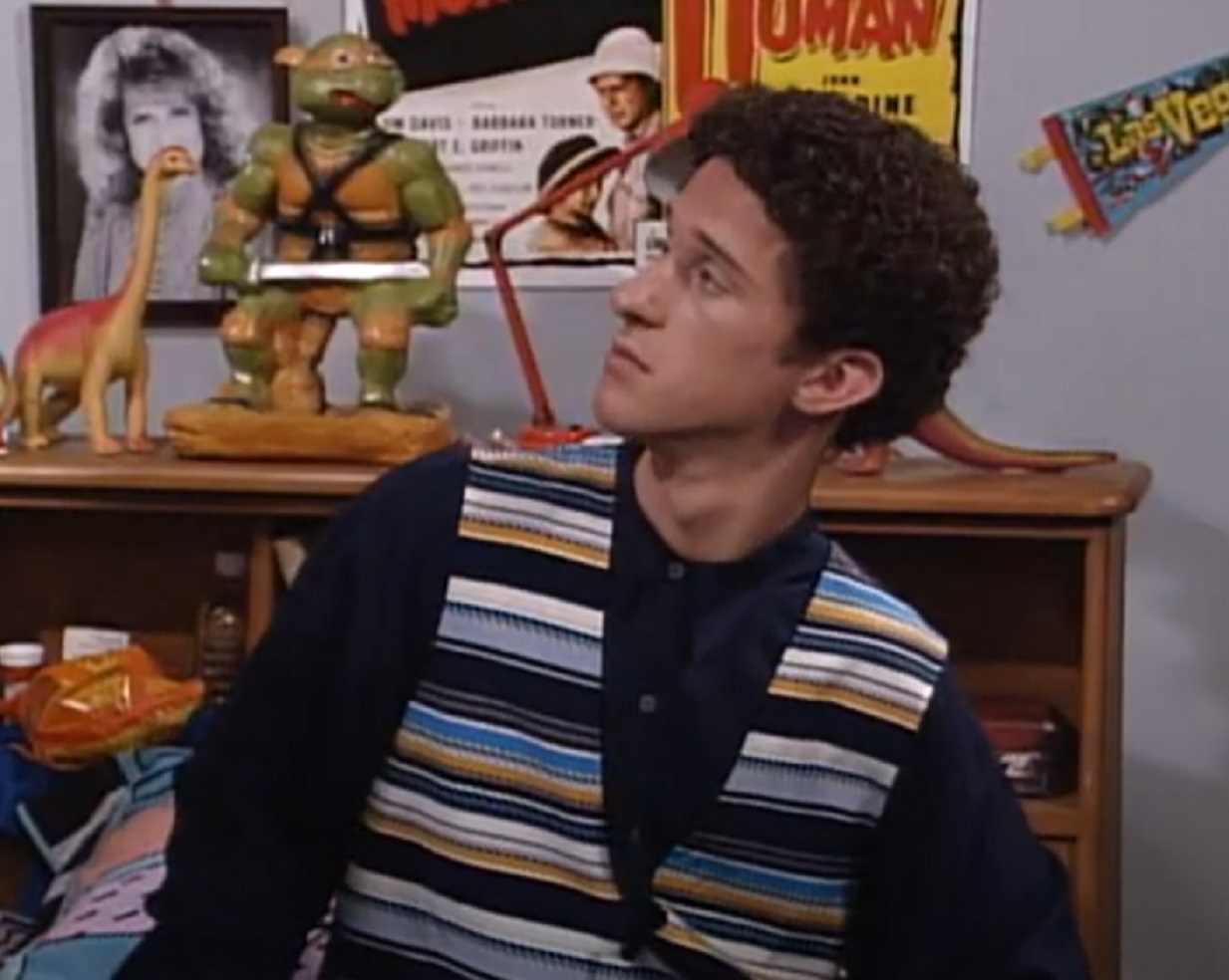Screenshot: Dustin Diamond is looking at side surprised - from Saved by the Bell: The College Years (1993-1994)