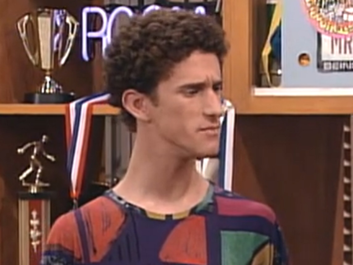 Screenshot: Dustin Diamond is looking at side with upset face - from Saved by the Bell: The College Years (1993-1994)