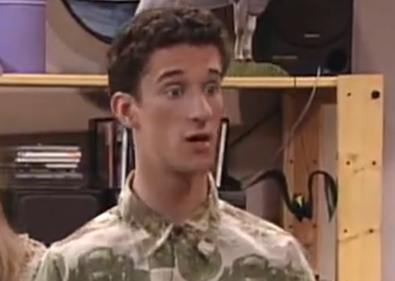 Screenshot: Dustin Diamond is looking at side with surprised face - from Saved by the Bell: The College Years (1993-1994)
