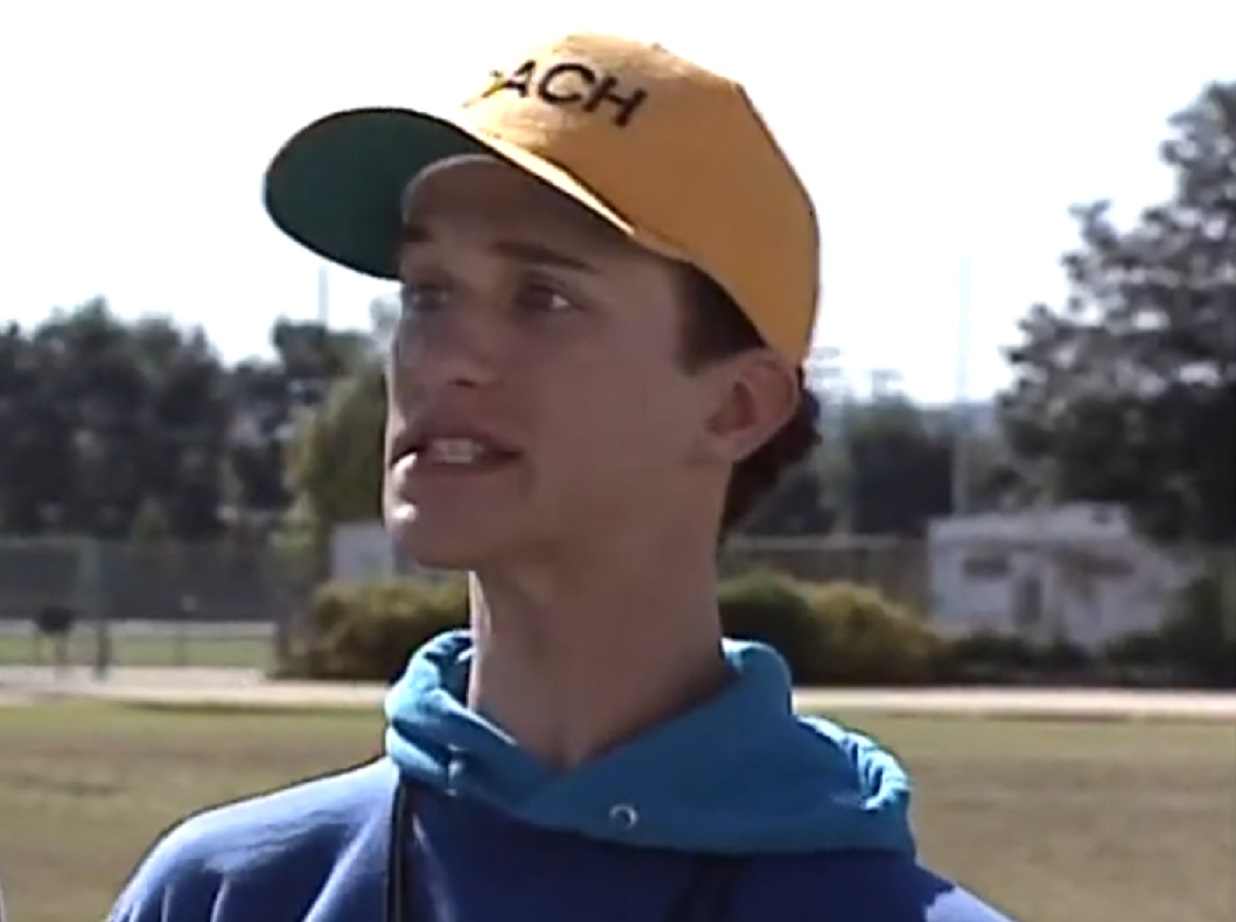 Screenshot: Dustin Diamond wearing yellow cap is looking at side upset  - from Saved by the Bell: The College Years (1993-1994)