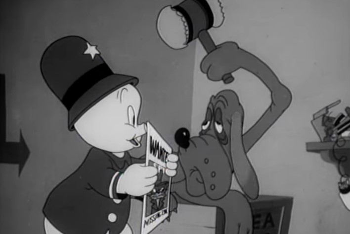 Porky  trying to wake up his bloodhound