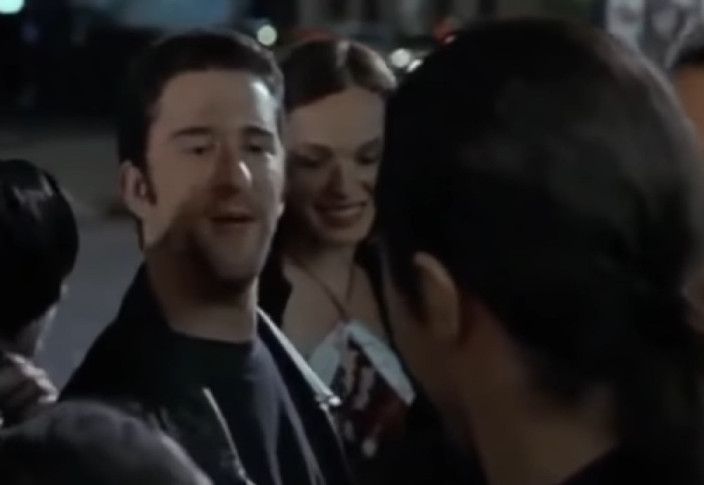 Screenshot: Dustin Diamond is talking in front of people outside - from Made (2001)