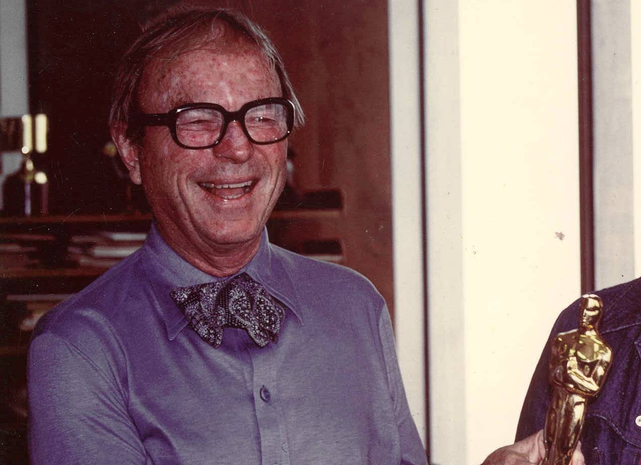 Chuck Jones holding an Oscar