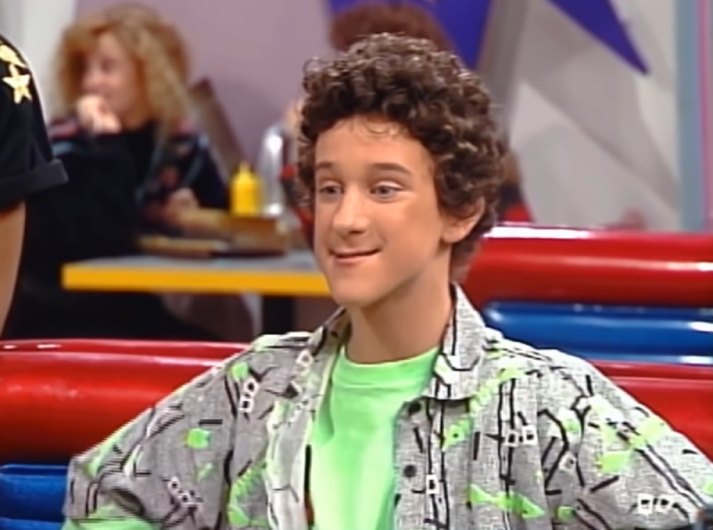 Screenshot: Dustin Diamond is looking at front and smiling - from Saved by the Bell (1989-93)