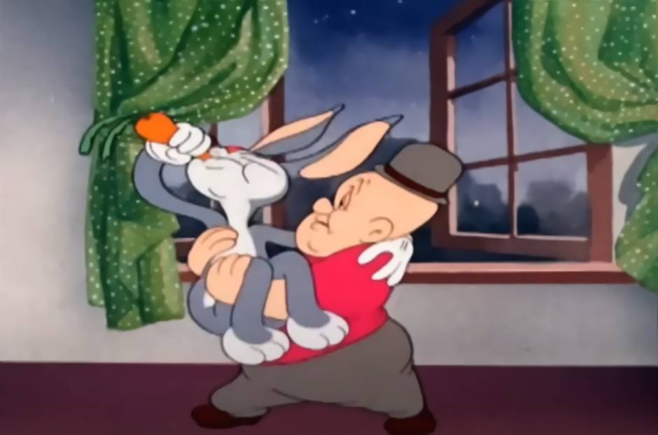 Elmer carrying Bugs Bunny in his arms while Bugs is eating a carrot