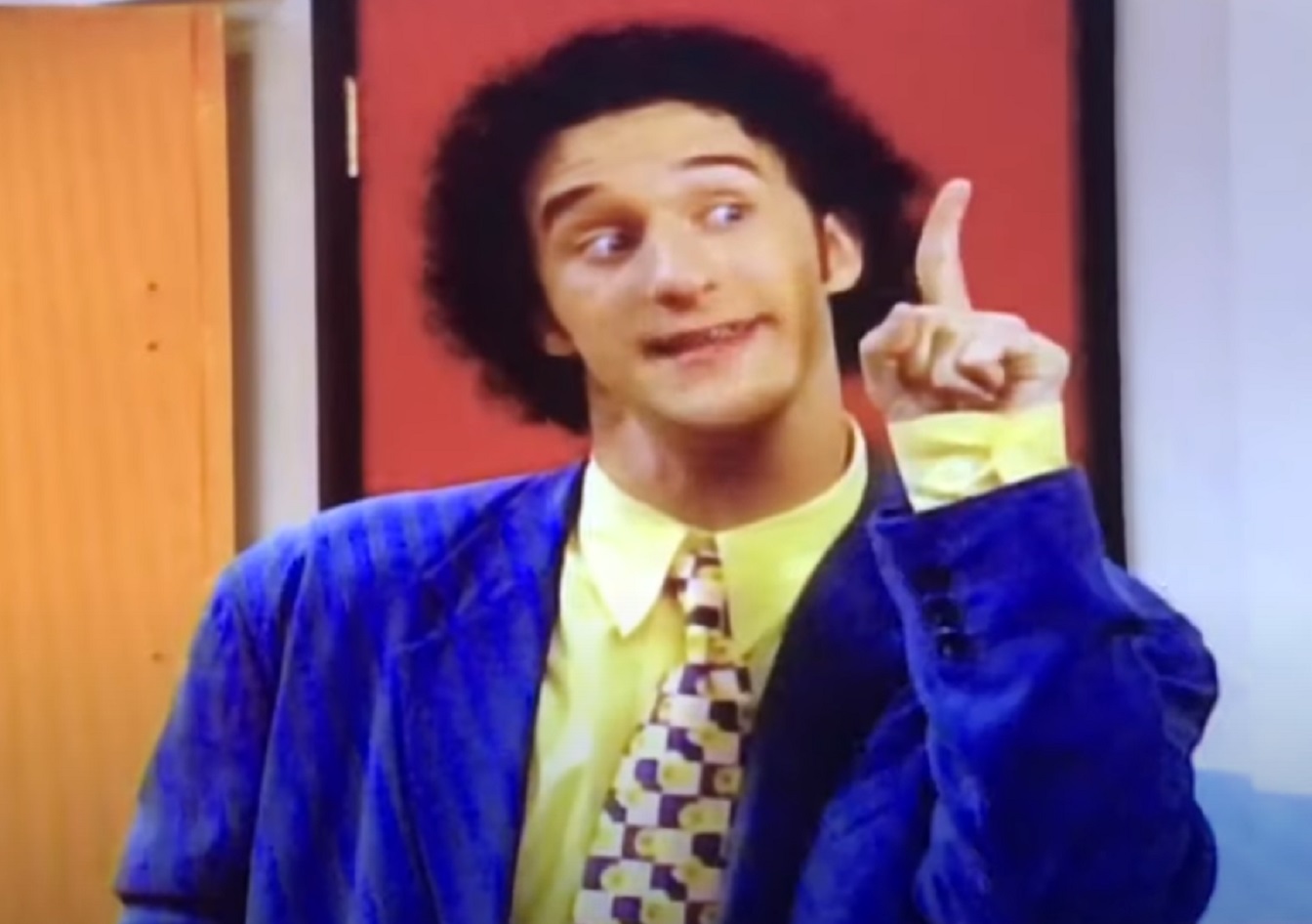 Screenshot: Dustin Diamond wearing blue jacket is pointing up with finger - from Saved by the Bell: The New Class (1993-2000)
