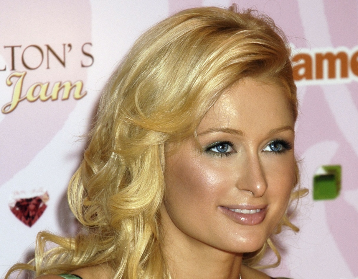 Paris Hilton is looking at side and smiling - 2010