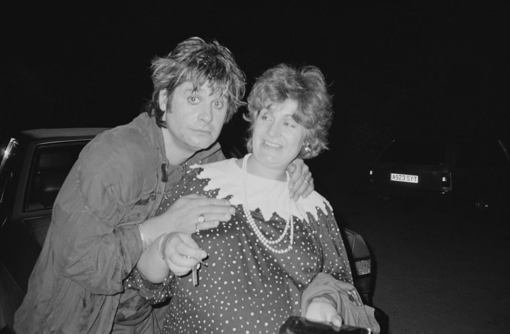 Ozzy Osbourne poses with his wife Sharon Osbourne at Ridge Farm Studios in West Sussex during the recording of 'Bark At The Moon' album in August 1983  hugging