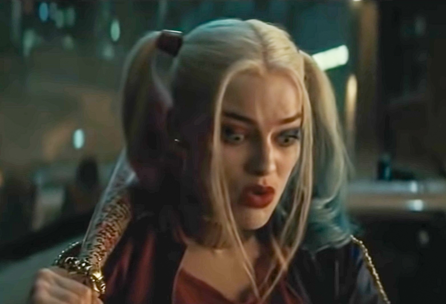 Screenshot: Harley Quinn (Margot Robbie) is holding a bat and looking shocked - from Suicide Squad (2016)