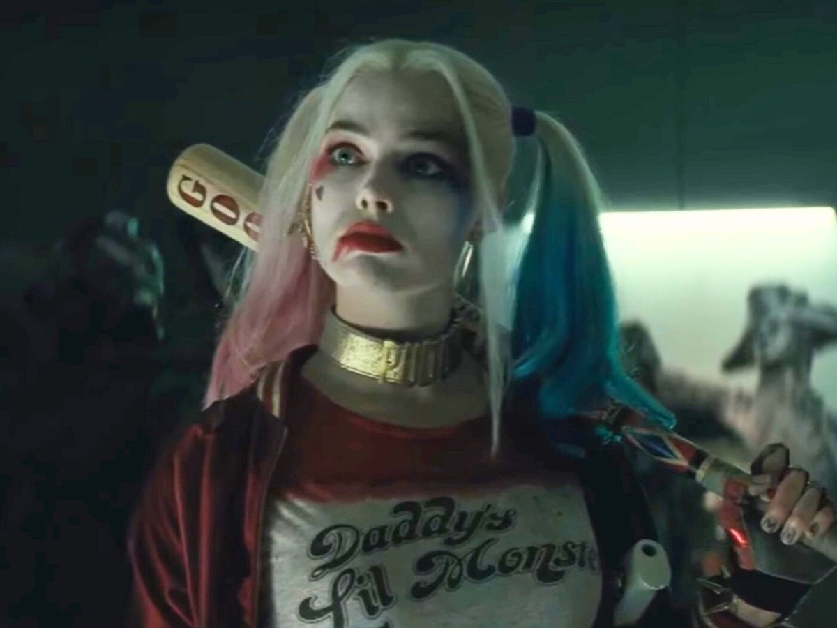 Screenshot: Harley Quinn (Margot Robbie) is holding a bat and looking at side - from Suicide Squad (2016)