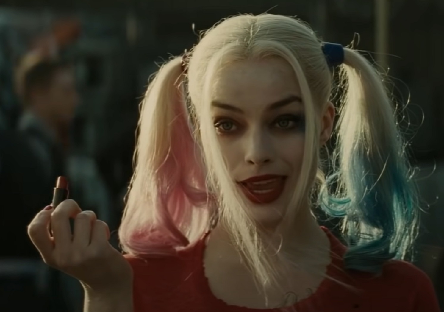 Screenshot: Harley Quinn (Margot Robbie) with red lipstick - from Suicide Squad (2016)