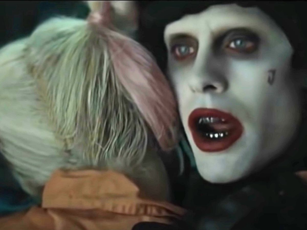 Screenshot: Harley Quinn and The Joker are hugging - from Suicide Squad (2016)