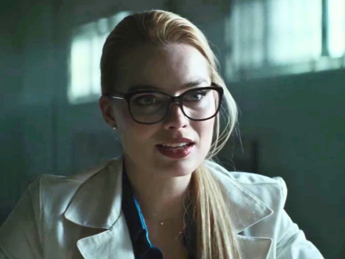 Screenshot: Harley Quinn (Margot Robbie) wearing white coat and glasses - from Suicide Squad (2016)