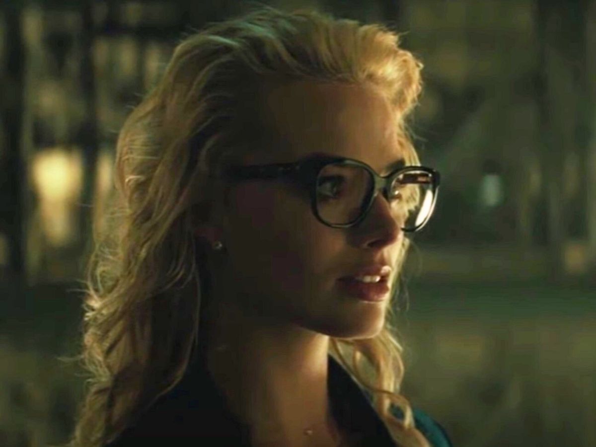 Screenshot: Harley Quinn (Margot Robbie) wearing black jacket and glasses - from Suicide Squad (2016)