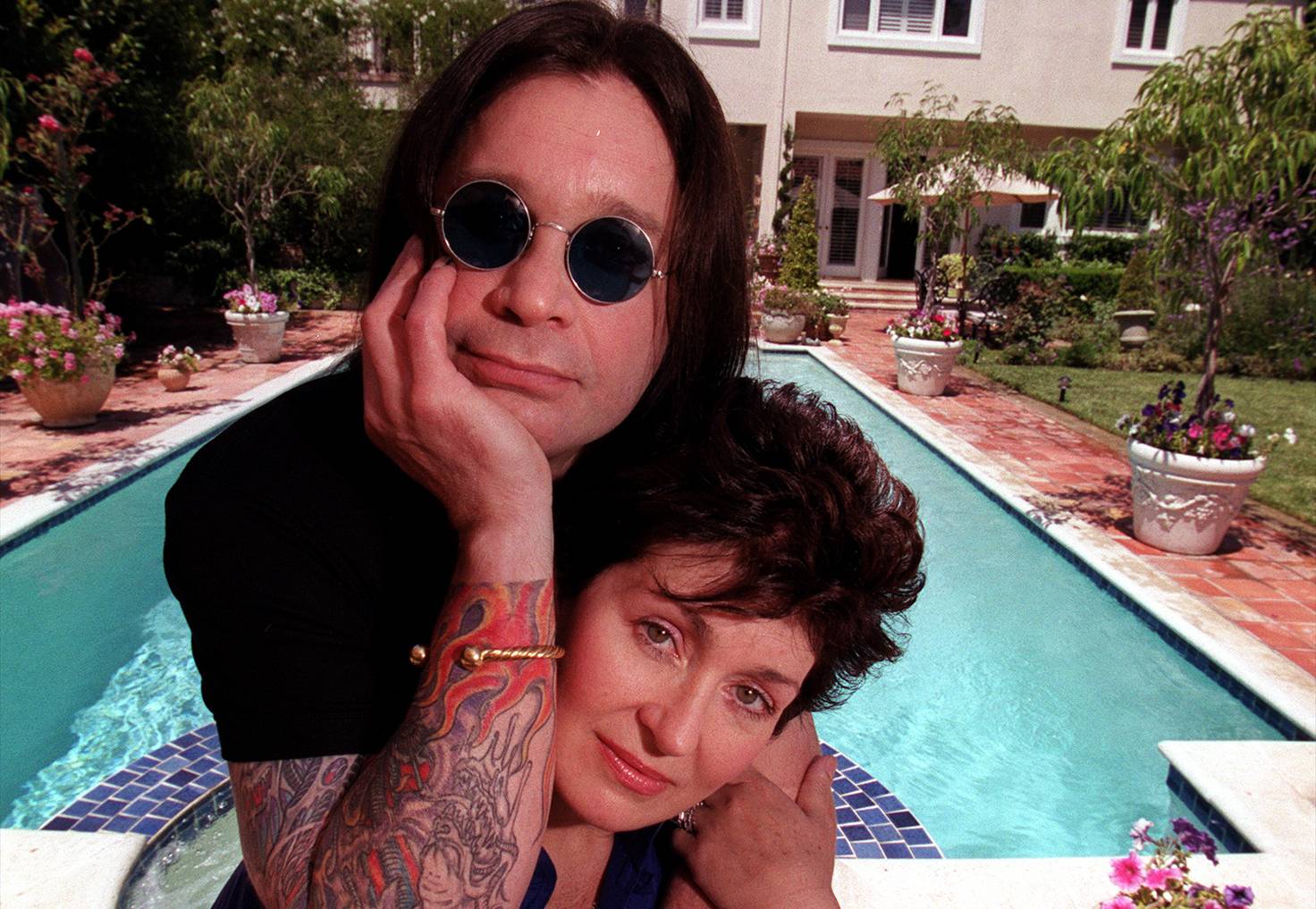 In the backyard of their Beverly Hills home singer Ozzy Osbourne and wife Sharon Osbourne for an upfront Sunday calendar story