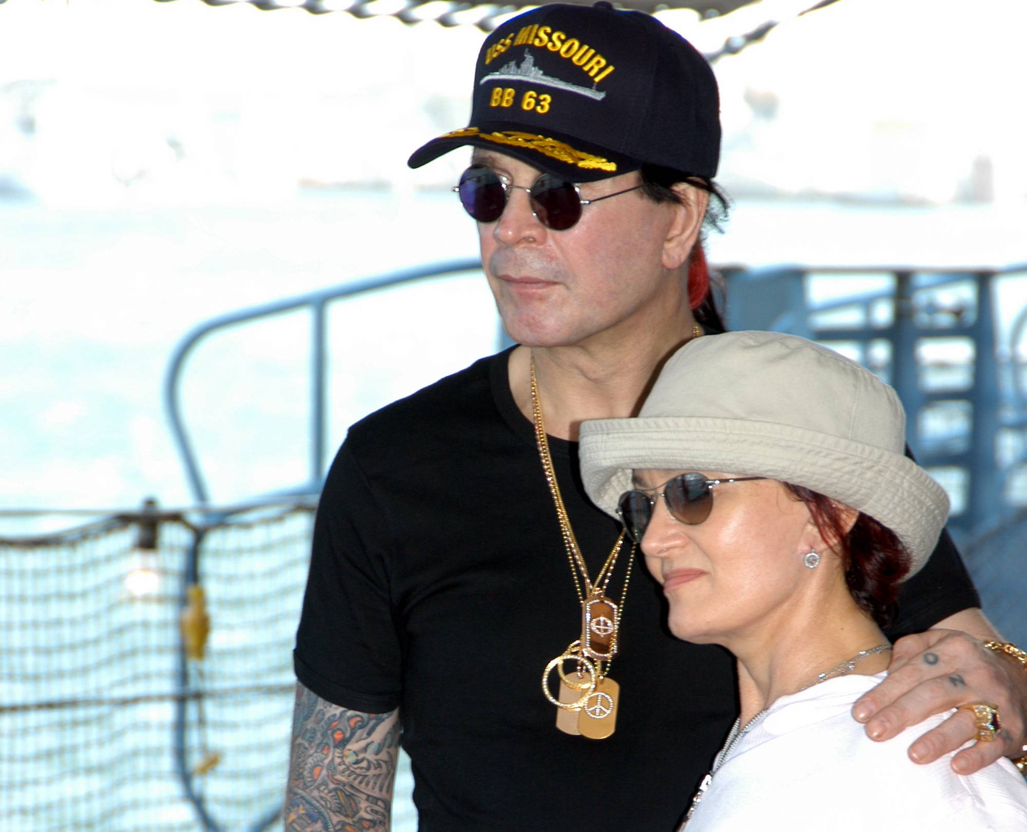 Ozzy Osbourne and his wife Sharon, tour the battleship USS Missouri in hats