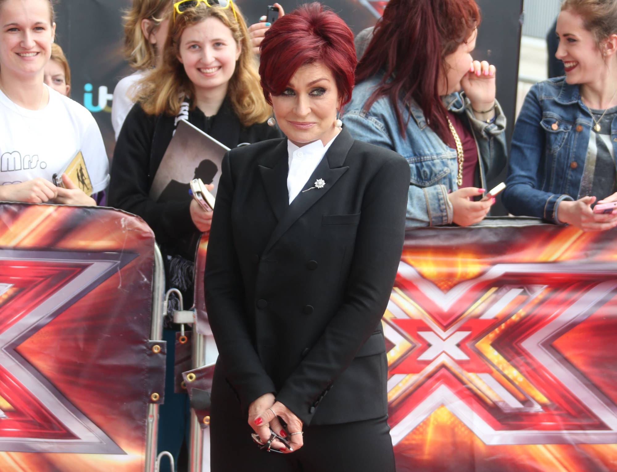 Sharon Osbourne at The X Factor auditions held at London Excel London in black suit