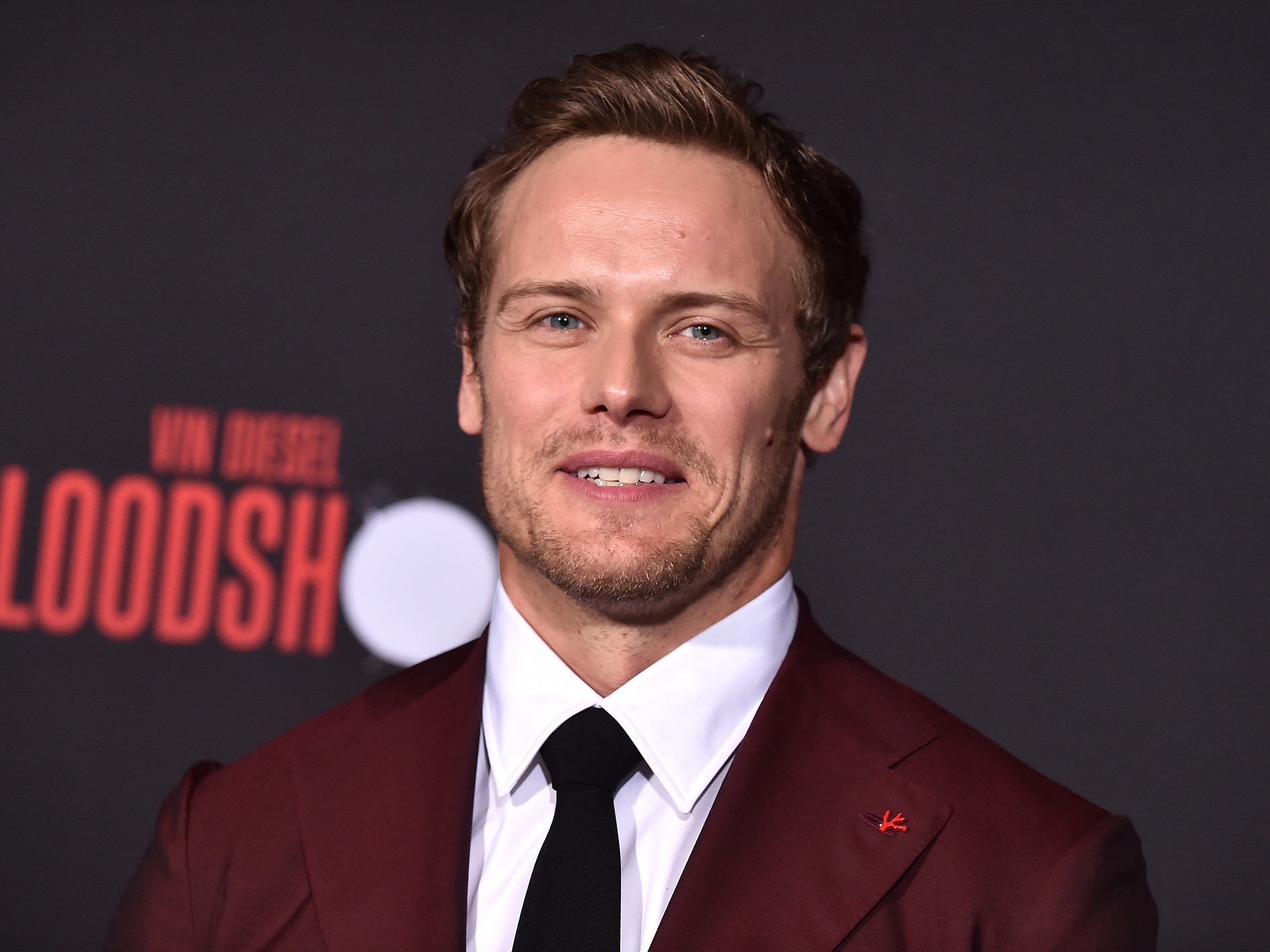 Sam Heughan is smiling and looking at camera - 2020