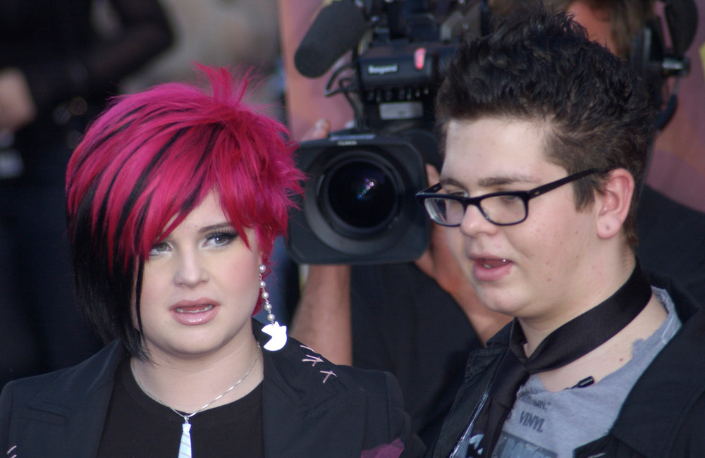 Singer KELLY OSBOURNE & brother JACK OSBOURNE, children of Ozzie Osbourne, at the MTV Movie Awards in Los Angeles. 01 JUN 2002,